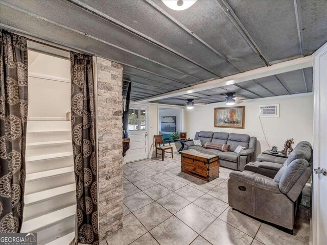 tiled living room featuring ceiling fan