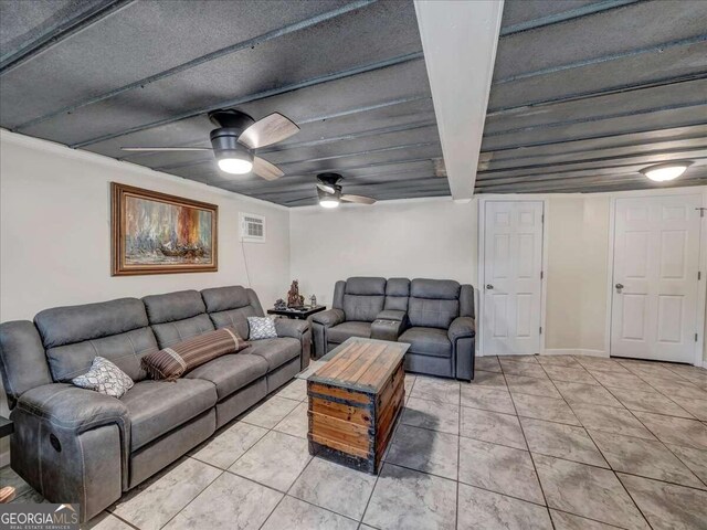 tiled living room with a textured ceiling and ceiling fan