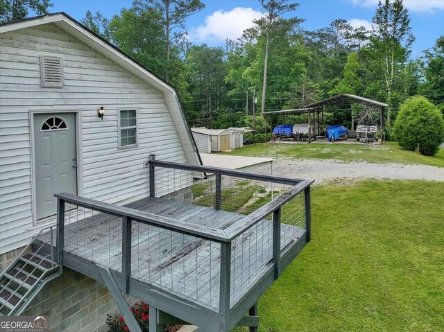 wooden deck featuring a shed and a yard