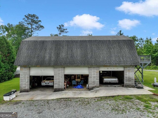 garage with a yard