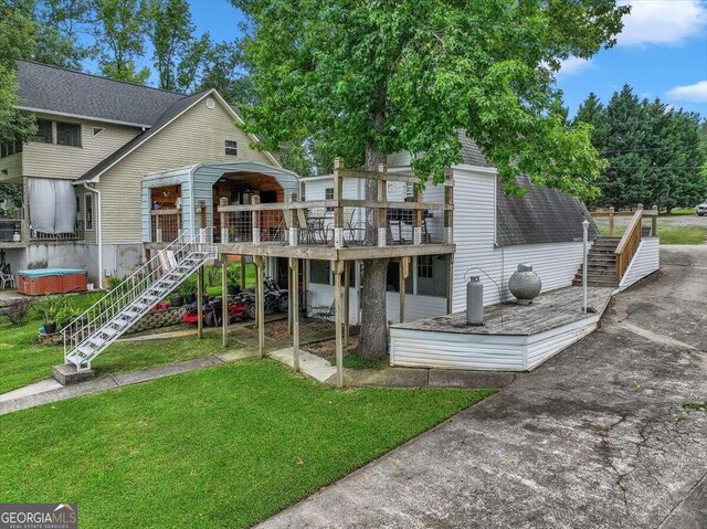 exterior space with a wooden deck and a yard