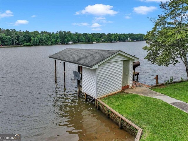 view of dock featuring a yard and a water view