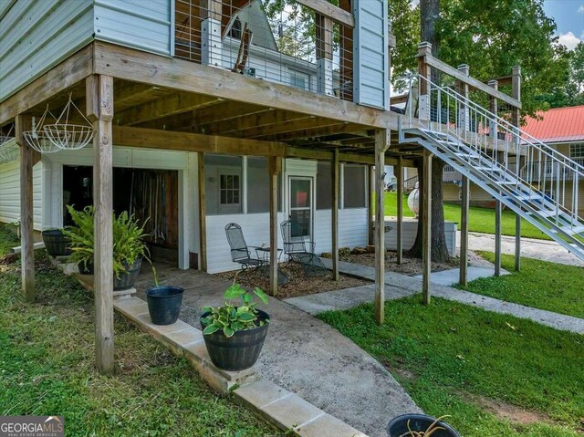 doorway to property featuring a yard