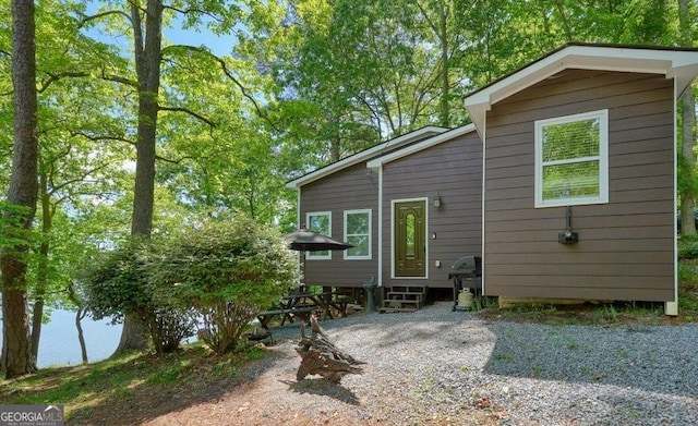 rear view of property with entry steps