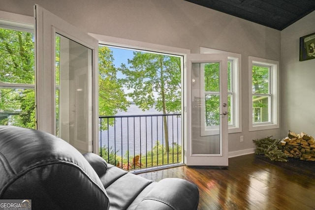 sunroom / solarium featuring lofted ceiling