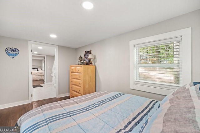 bedroom featuring dark hardwood / wood-style flooring