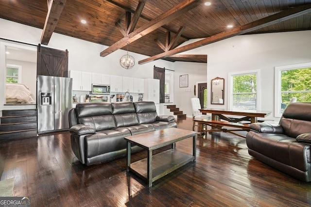 living area with stairs, wooden ceiling, dark wood finished floors, and a barn door