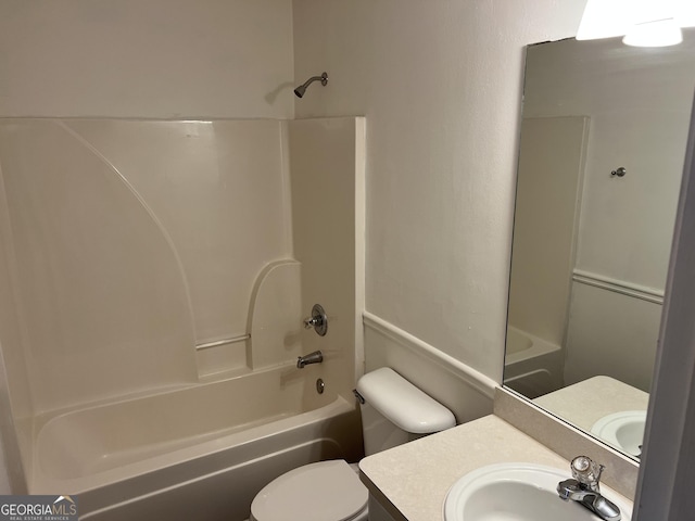 full bathroom with shower / washtub combination, vanity, and toilet