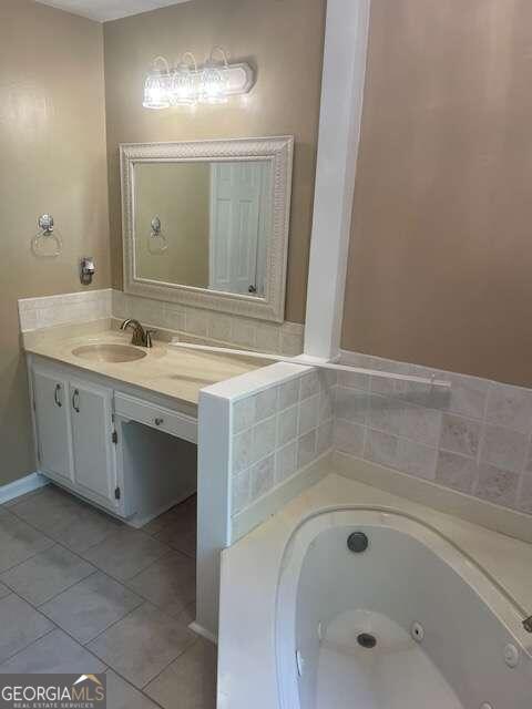 bathroom with tile flooring and vanity