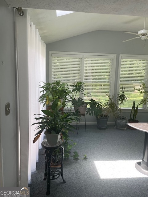 sunroom / solarium featuring vaulted ceiling and ceiling fan