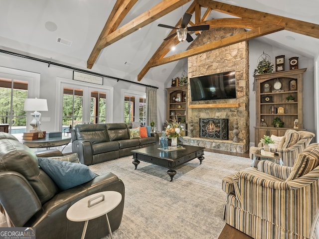 living room featuring wood-type flooring, a fireplace, ceiling fan, high vaulted ceiling, and beamed ceiling