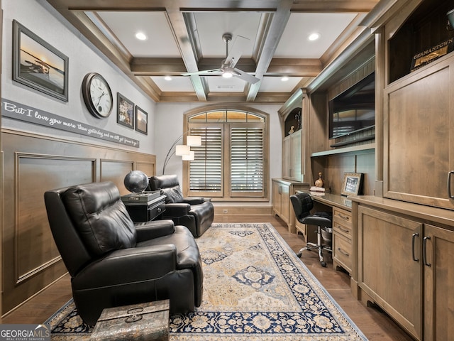 office featuring beam ceiling, hardwood / wood-style floors, coffered ceiling, and ceiling fan