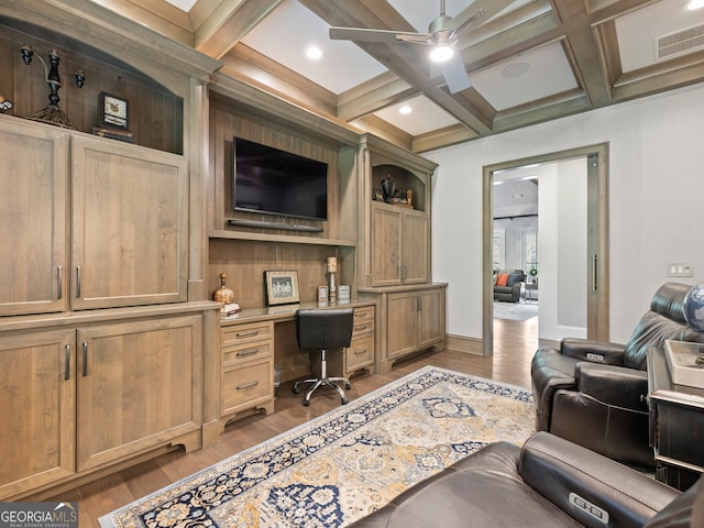 office area with beam ceiling, ceiling fan, coffered ceiling, and light hardwood / wood-style flooring