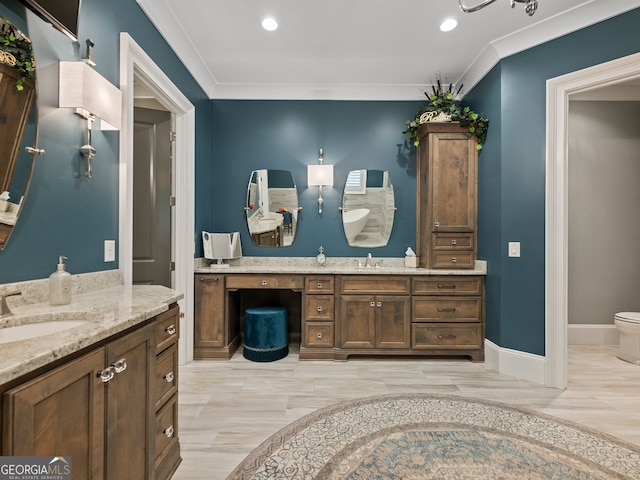 bathroom with vanity and ornamental molding