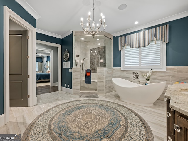 bathroom with tile walls, crown molding, vanity, and a tile shower