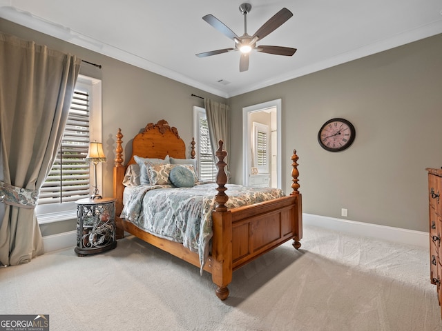 bedroom with crown molding, carpet floors, and ceiling fan