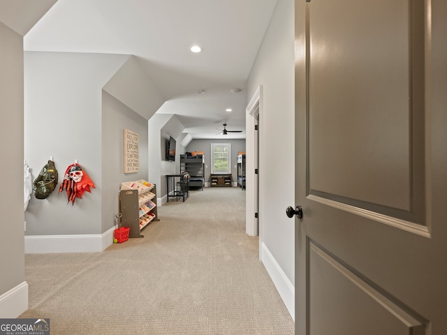 hall featuring light colored carpet