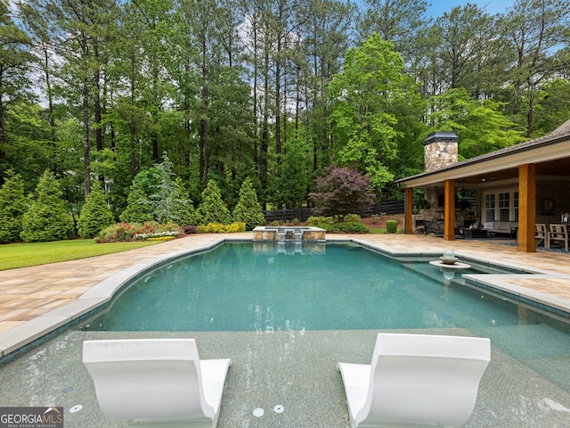 view of swimming pool with a patio