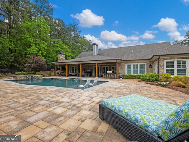 view of swimming pool with a patio area