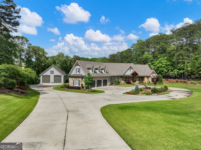 view of front of house with a front yard and a garage