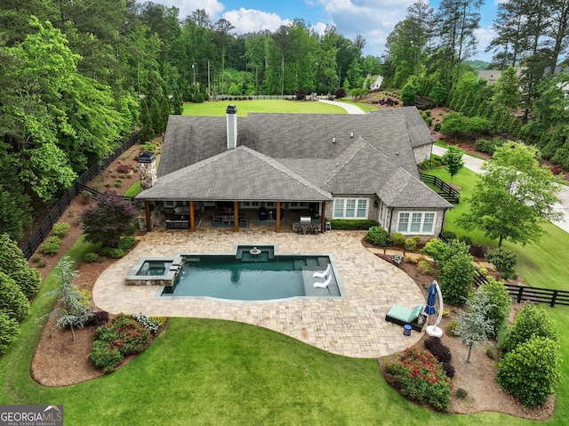 view of swimming pool with a lawn