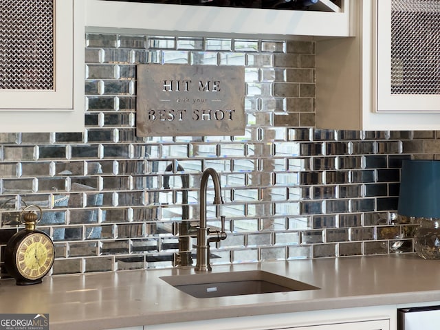 room details with sink and tasteful backsplash