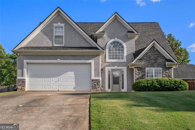 craftsman-style house featuring a front yard and a garage