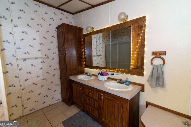 bathroom with tile floors, large vanity, and double sink