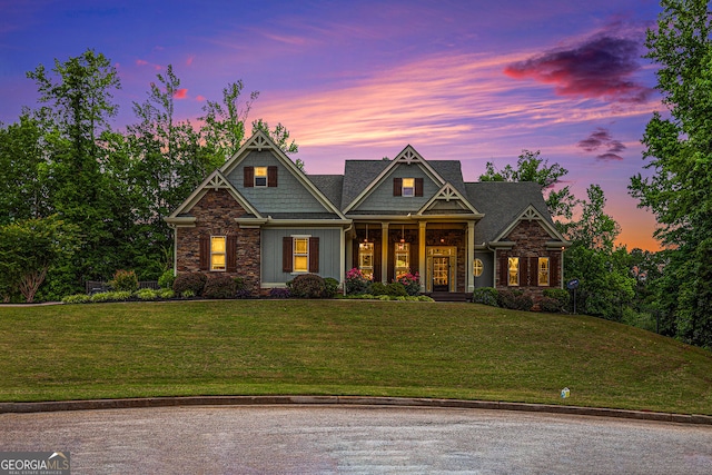 craftsman house featuring a yard