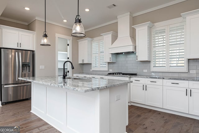 kitchen with stainless steel appliances, tasteful backsplash, premium range hood, and dark hardwood / wood-style floors