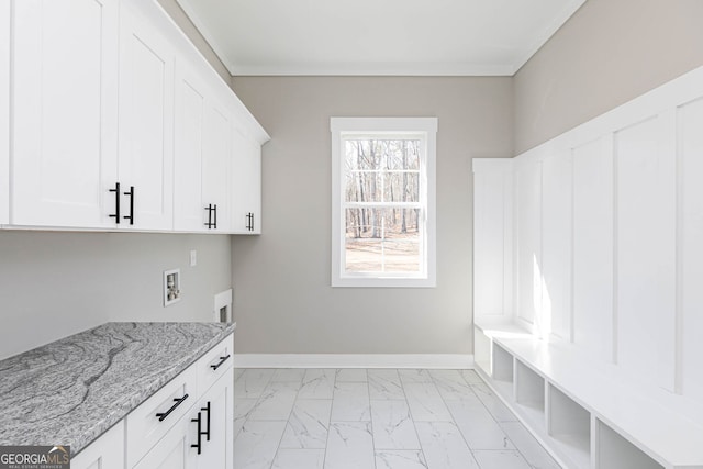 laundry room featuring cabinets, hookup for a washing machine, and light tile floors