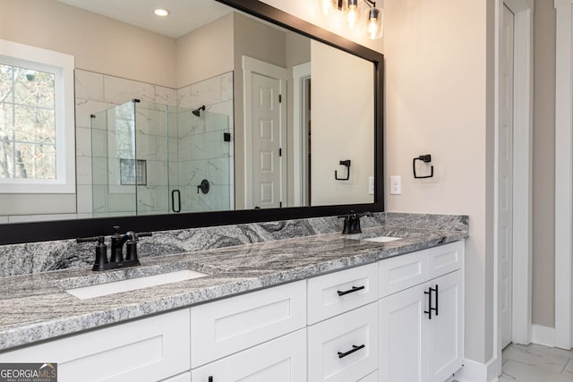 bathroom featuring dual vanity, tile floors, and a shower with door