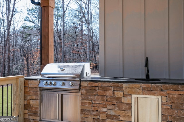 exterior space with sink and a grill