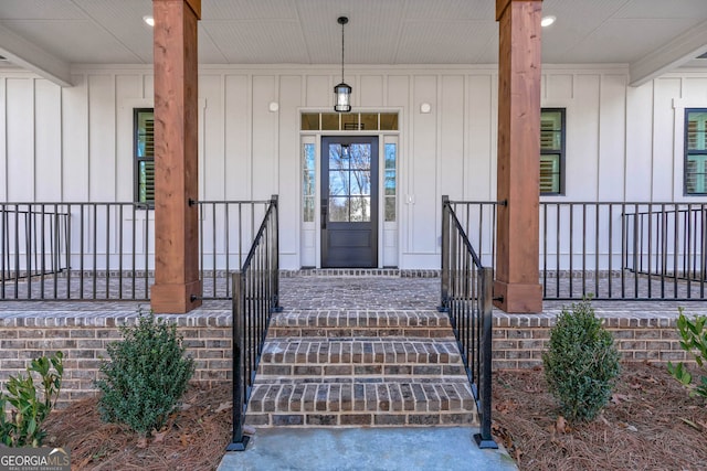 doorway to property featuring covered porch