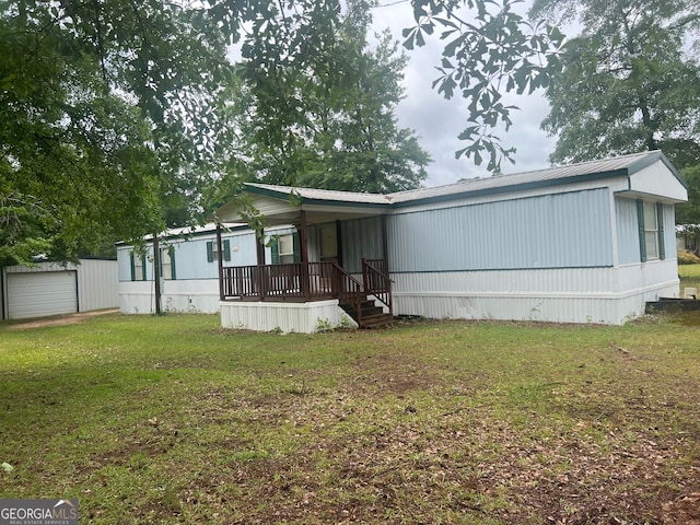 back of house with a lawn