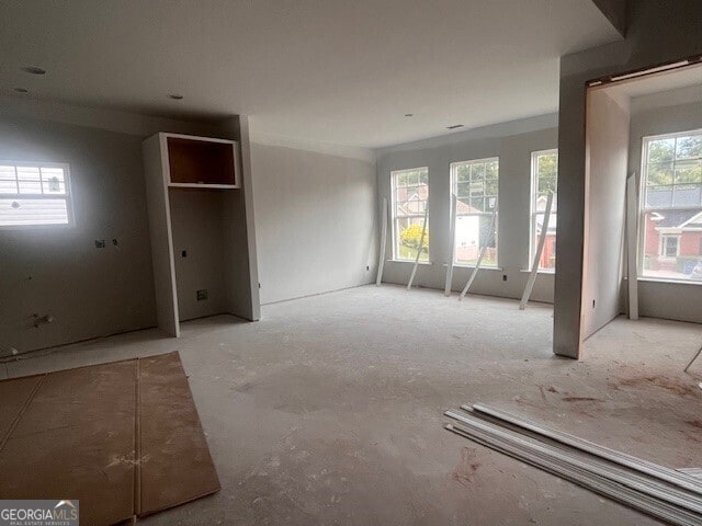 unfurnished bedroom with multiple windows