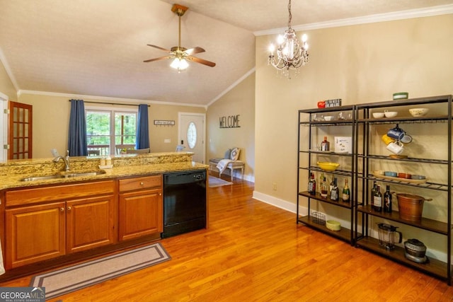 kitchen featuring light stone countertops, dishwasher, sink, vaulted ceiling, and light wood-type flooring