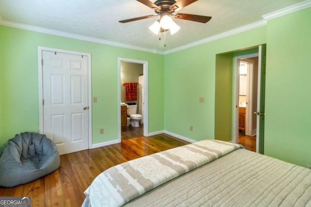 bedroom featuring hardwood / wood-style flooring, ceiling fan, ornamental molding, and ensuite bath