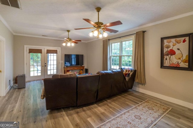 living room with plenty of natural light and hardwood / wood-style floors