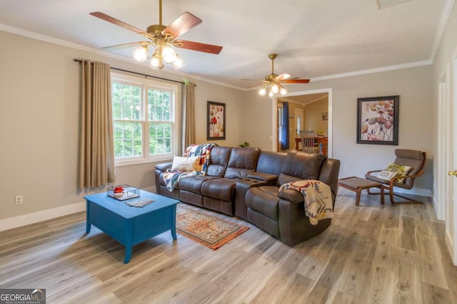 living room featuring light wood-type flooring, ceiling fan, and crown molding