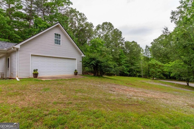 exterior space with a lawn and a garage