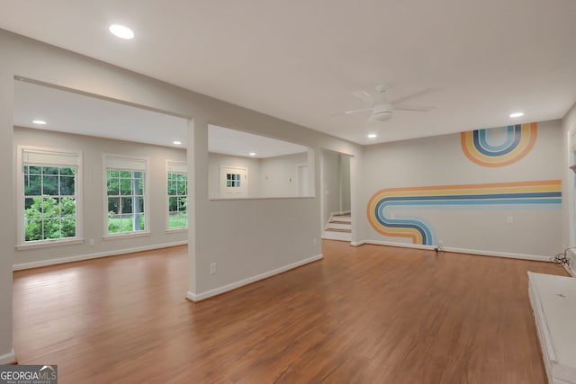 interior space with hardwood / wood-style flooring and ceiling fan