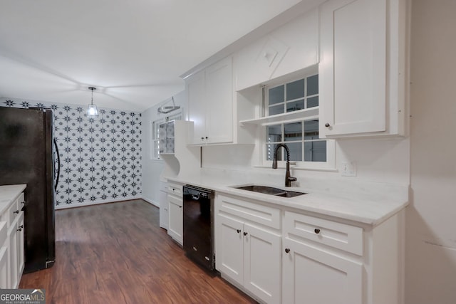 kitchen featuring dark hardwood / wood-style floors, pendant lighting, black appliances, sink, and white cabinets