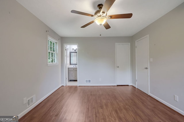 spare room featuring ceiling fan and hardwood / wood-style floors