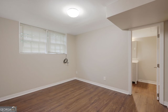 unfurnished bedroom featuring dark wood-type flooring