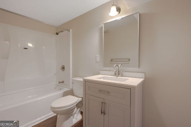 full bathroom with shower / washtub combination, vanity with extensive cabinet space, hardwood / wood-style flooring, and toilet