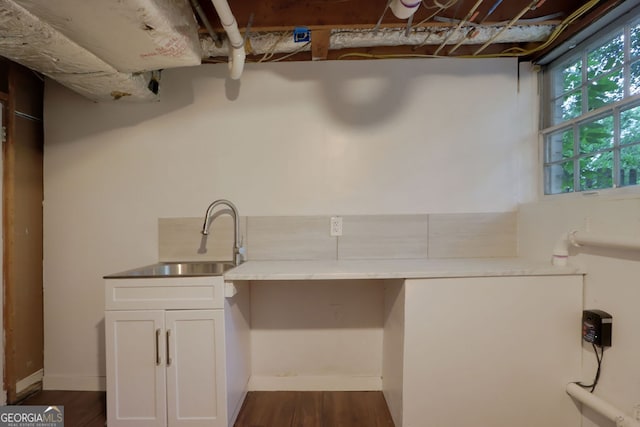 interior space featuring sink and dark hardwood / wood-style flooring