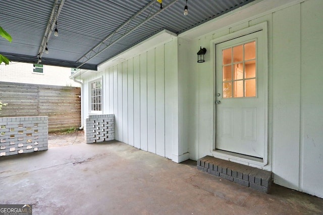 doorway to property with a patio area