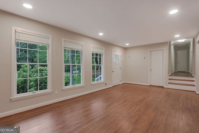 unfurnished room featuring hardwood / wood-style flooring