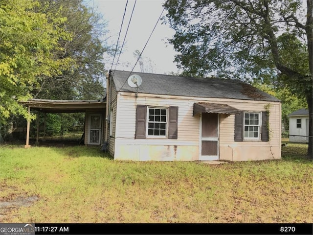 659 Richmond St, Macon, GA 31206 - view of front of home featuring a front yard and a carport